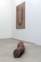 Log, oil crayon, rope.